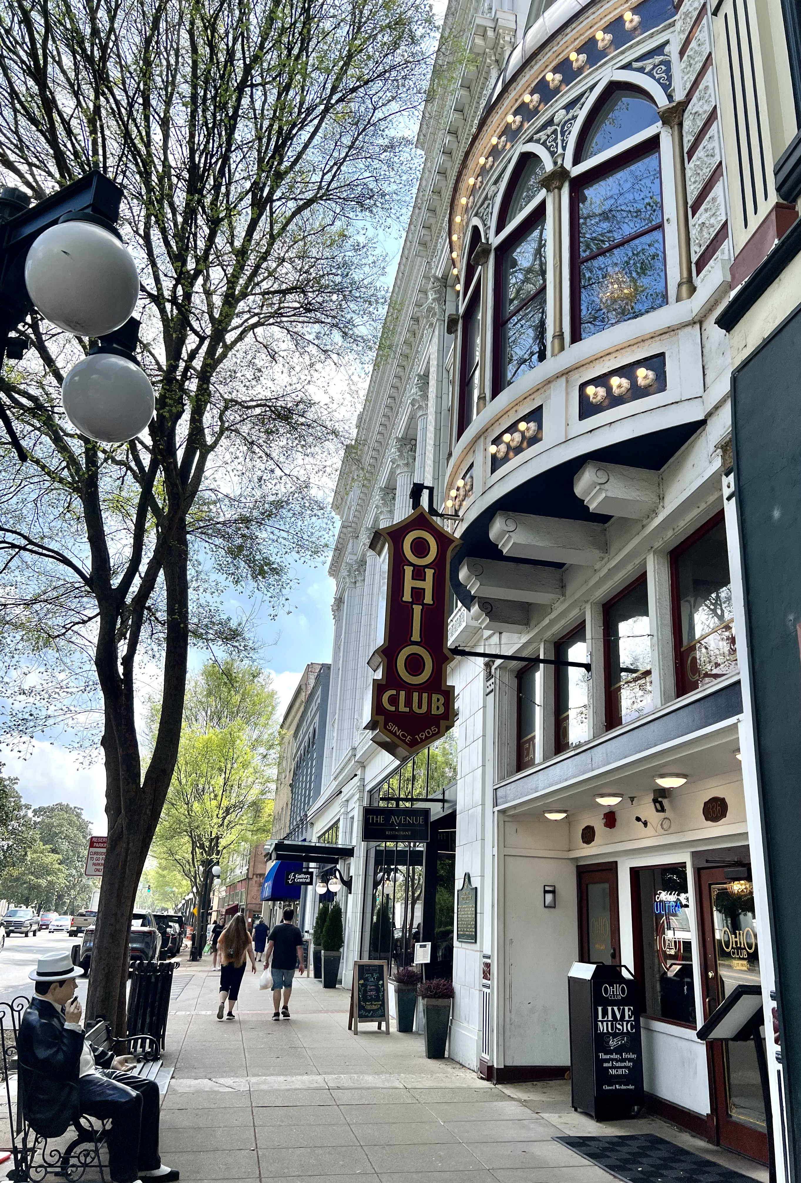 Victorian era commercial building entrance with large Ohio Club sign.