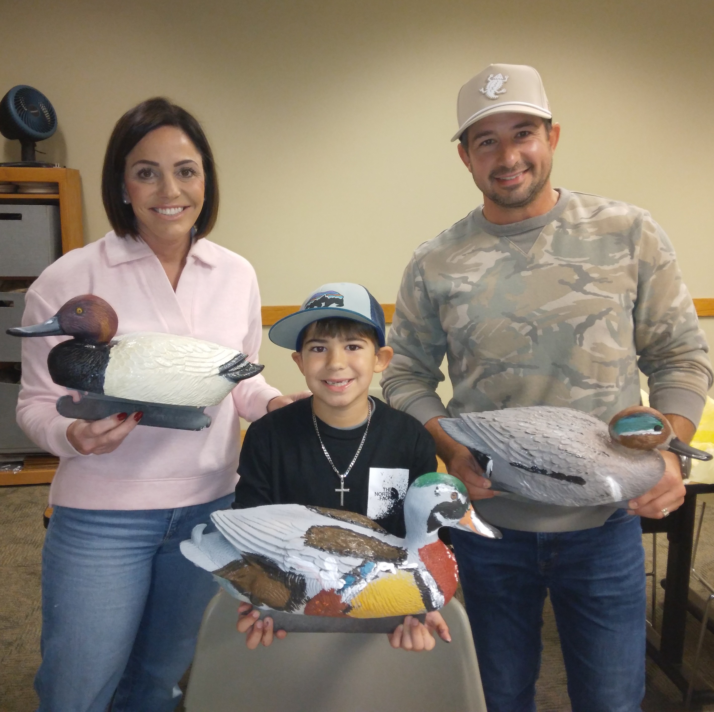 Picture of a family with painted duck decoys