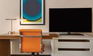 desk + chair + tv in guest room