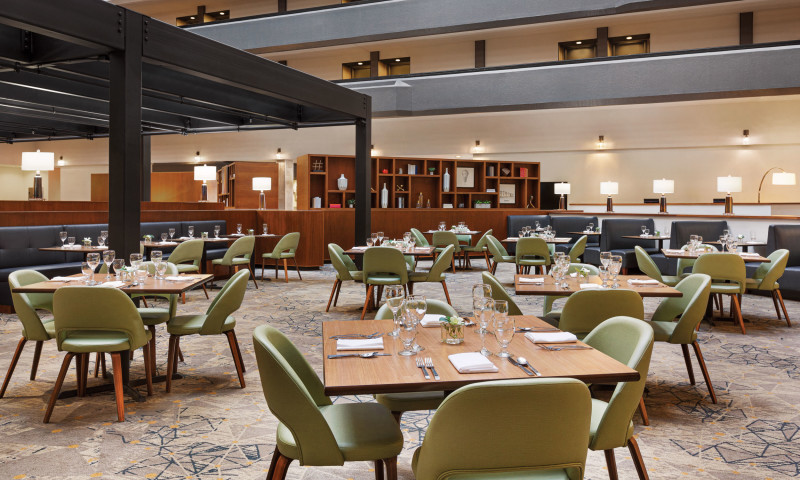 hotel atrium - dining area - tables + chairs