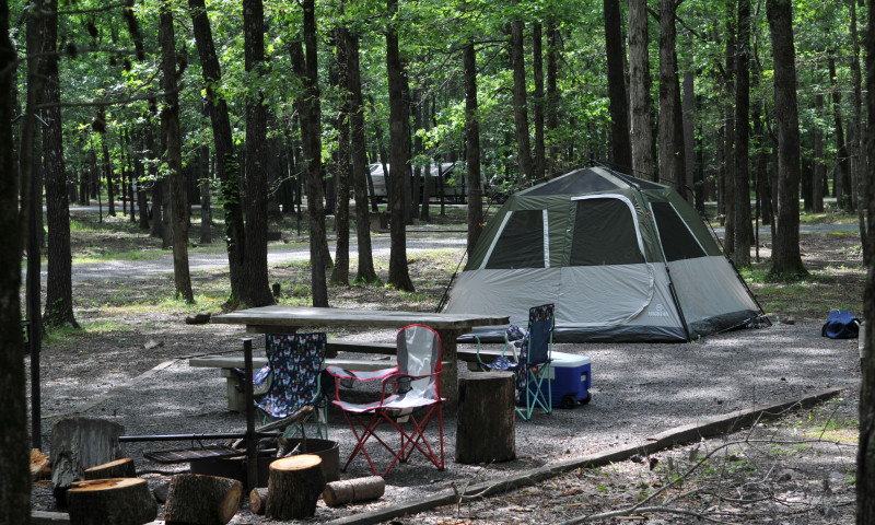 Tent and chairs set up at a campground