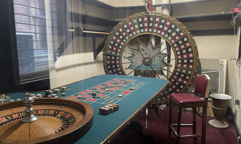Roulette table behind glass.
