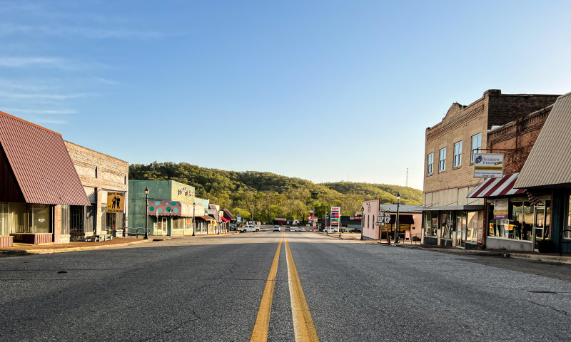 Street view of downtown Glenwood, with historic buildings on each side.
