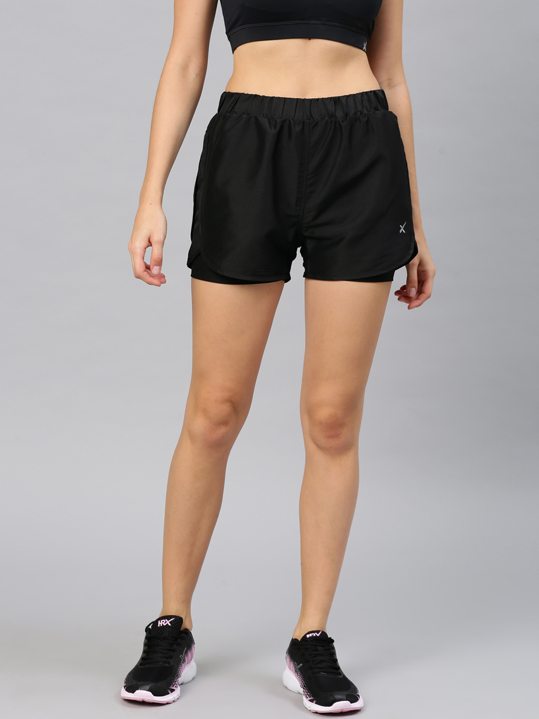 HRX by Hrithik Roshan Women Black Solid Regular Fit Sports Shorts Price in India