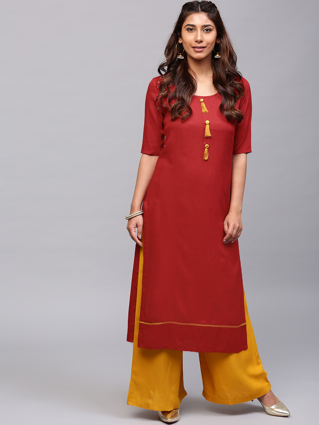 AKS Women Rust Red Solid Straight Kurta with Tassels Price in India