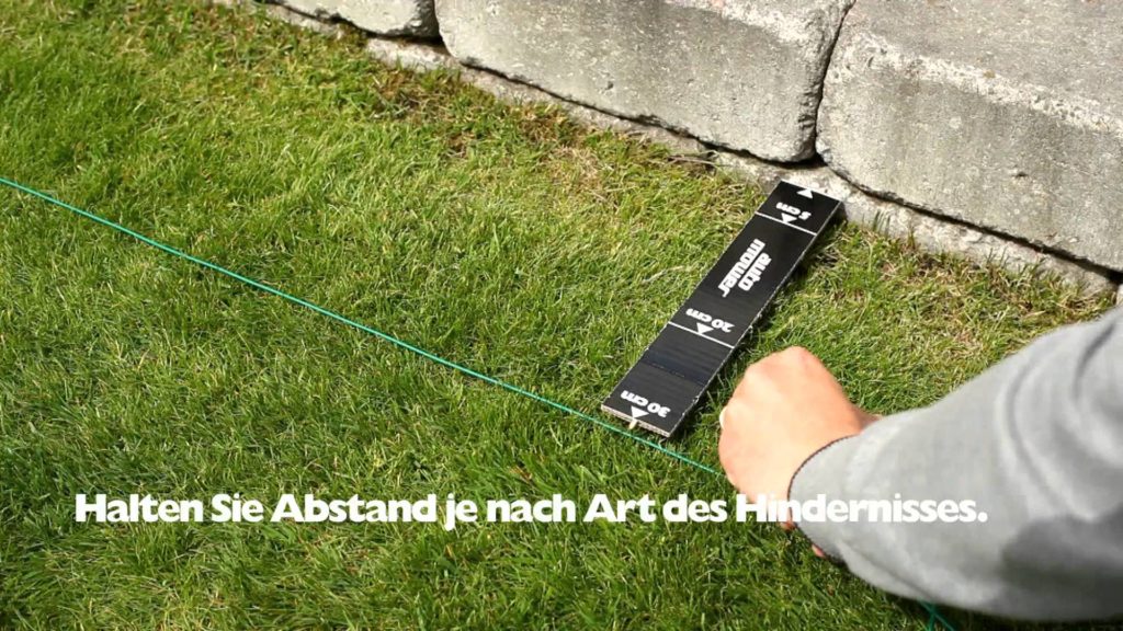 Begrenzungskabel begrenzen das zu mähende Areal Begrenzungskabel begrenzen das zu mähende Areal