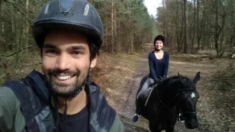 guini and balti riding in the forest