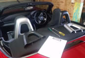 Installing silver rollover hoop covers on ND