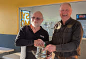 Ian Combes receives the NSW/VIC Interstate Challenge trophy from John Downes. Photo by Bryan Shedden.
