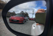 The MX-5s on the run rest a while outside the Bungonia Village Hall