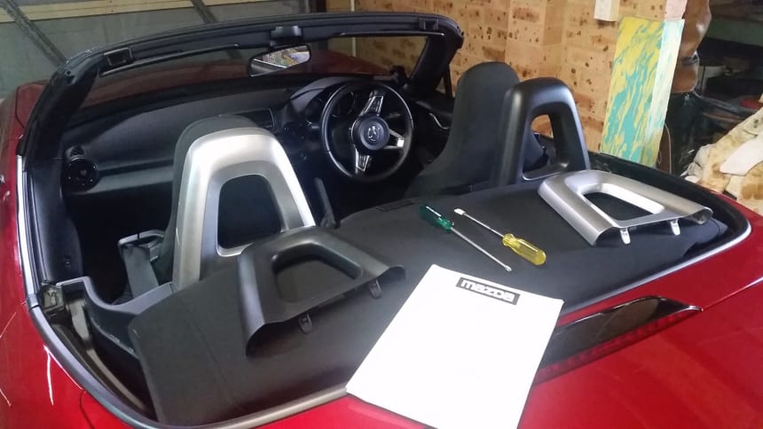 Installing silver rollover hoop covers on ND