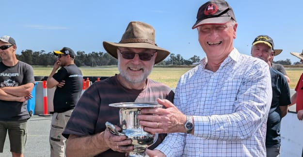 Ian Combes (NSW President) presents the trophy to John Downes (VIC Motorsport Captain)