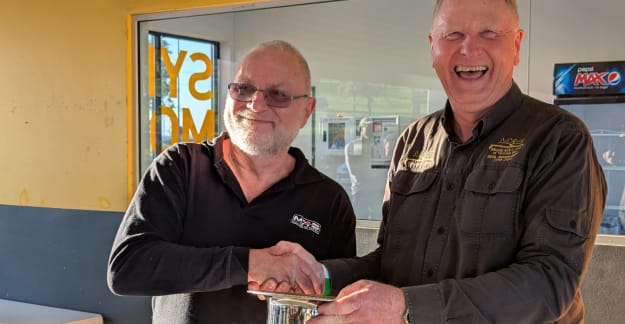 Ian Combes receives the NSW/VIC Interstate Challenge trophy from John Downes. Photo by Bryan Shedden.