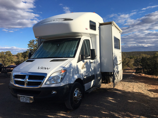 cozy rv equipped with a bike rack