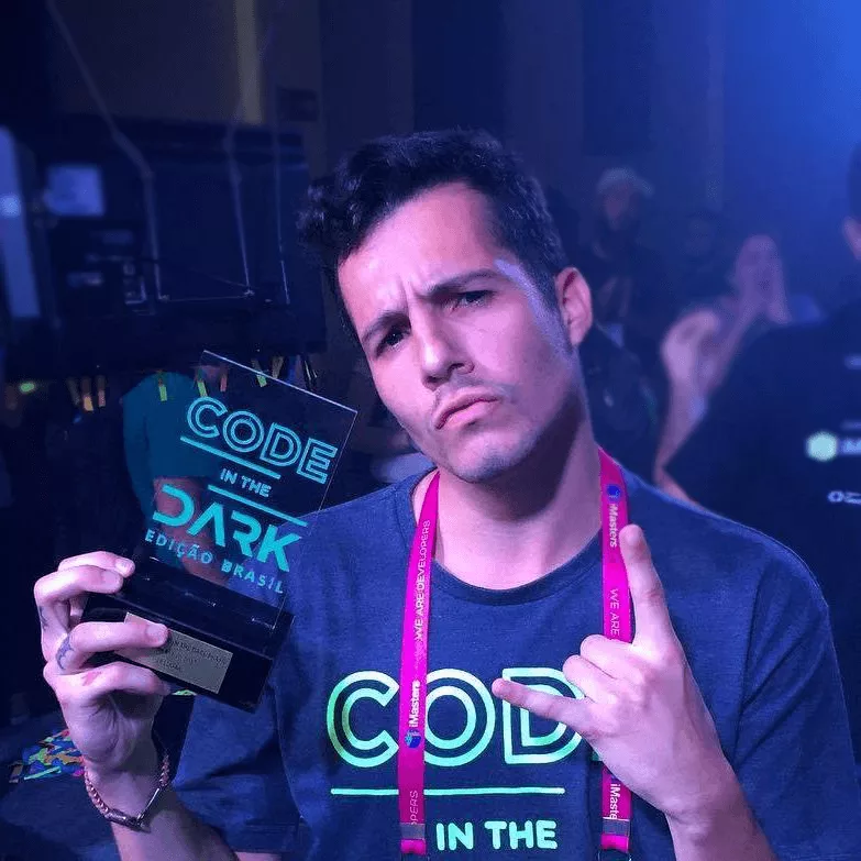 My profile photo holding the Code in the Dark award