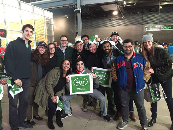 Photo of the Agency Within team during one of their outings at a Jets game.