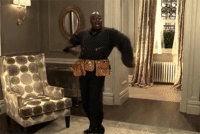 Titus pulling his uniform off to reveal a flashier outfit