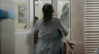 Abbi Abrams from Broad City, played by Abbi Jacobson, running for the NYC subway but failing as the doors close in front of her