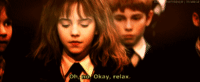 Hermione Granger from the Harry Potter movies, played by Emma Watson, saying, "Oh, no. Okay, relax"