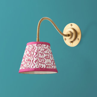 Lissome wall fitting in antiqued brass