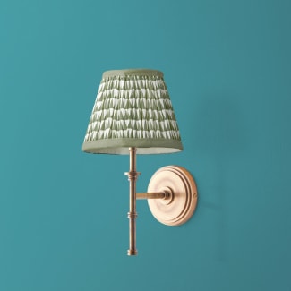Single Chukka cordless wall fixture in antique brass