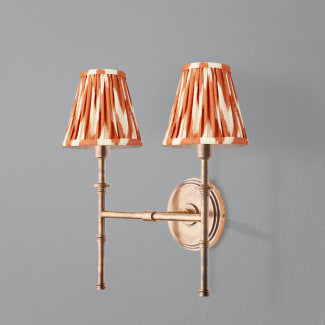 Larger Double chukka wall fixture in antiqued brass