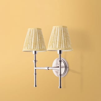 Double chukka wall fixture in antiqued silver