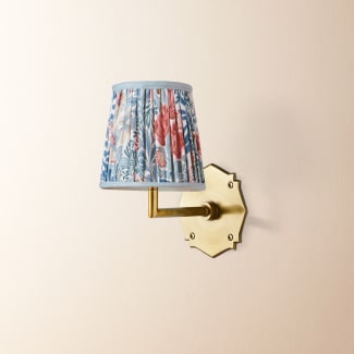 single insignia wall fitting in antique brass