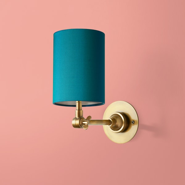 Beacon wall mounted candle holder in antiqued brass