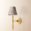 Wrappling wall fitting in antiqued brass
