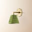 single insignia wall fitting in antique brass