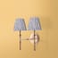 Double Chukka cordless wall fixture in antique brass