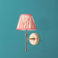 Single Chukka cordless wall fixture in antique brass