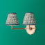 Double Insignia cordless wall fixture in antique brass