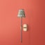 Besidem wall fixture in antiqued brass