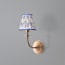 Pringle wall fixture in antiqued brass