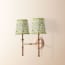 Double Chukka cordless wall fixture in antique brass