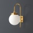 Turini wall fitting in antique brass