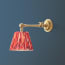 Double jointed wall fitting in antiqued brass