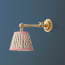 Double jointed wall fitting in antiqued brass