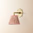 single insignia wall fitting in antique brass
