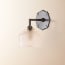 single insignia wall fitting in bronze