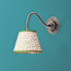 Lissome wall fitting in bronze