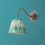 Lissome wall fitting in bronze
