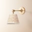 Elbow wall fitting in antiqued brass