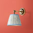 Rose wall fitting in antiqued brass