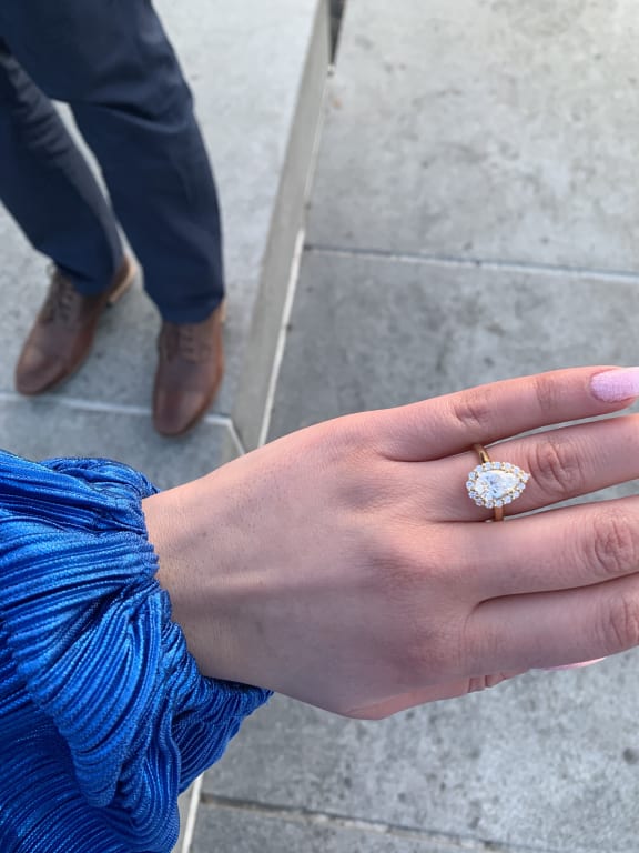 Oval diamond ring on hand