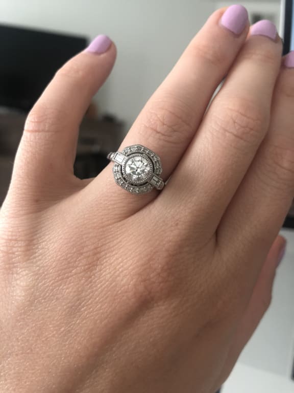 Oval diamond ring on hand