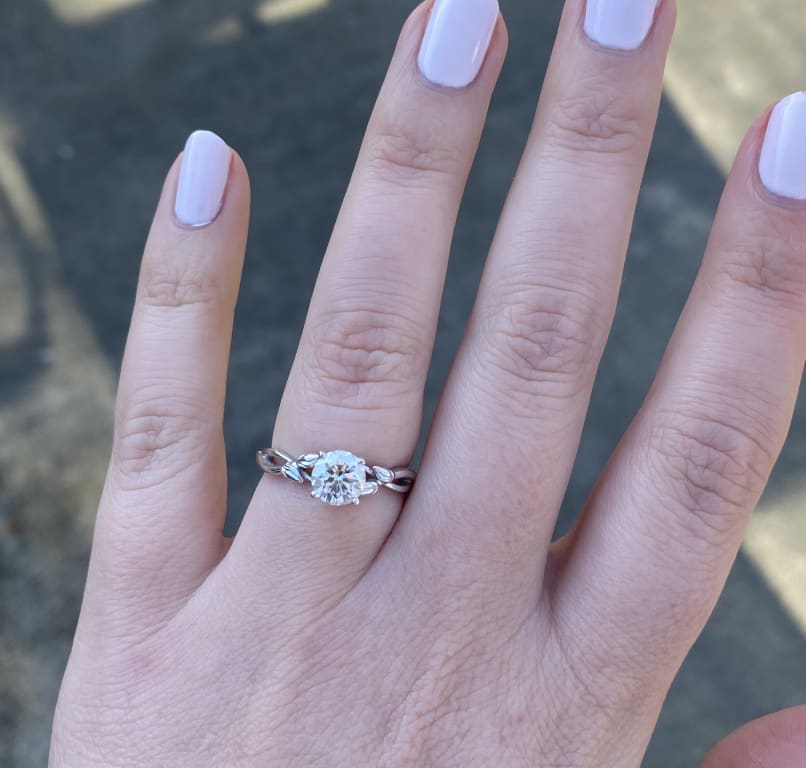 Oval diamond ring on hand