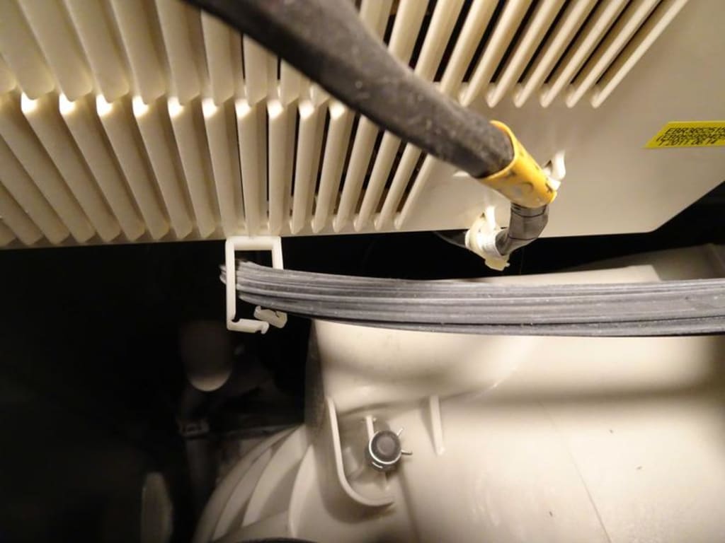Wire tie attached to bottom of board Wire tie attached to bottom of board